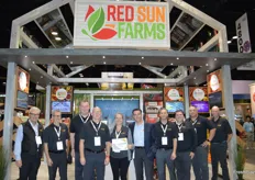Team Red Sun Farms. Leona Neill proudly shows the award the company won for Best Inland Booth in Produce. Congratulations!